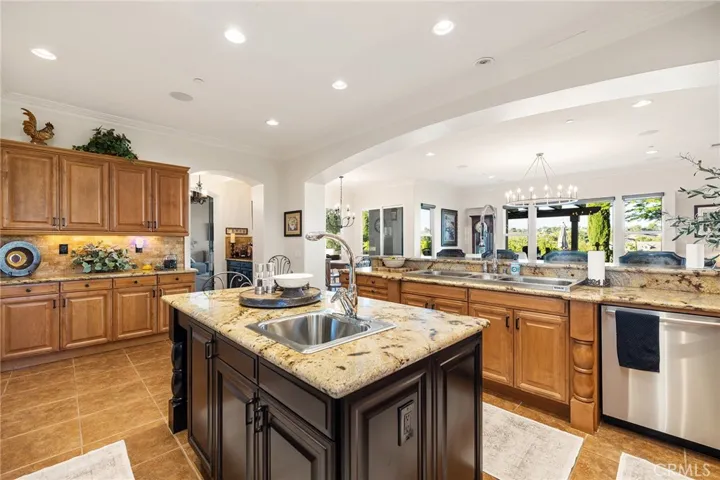 Kitchen open to the Family Room, with arched separation.