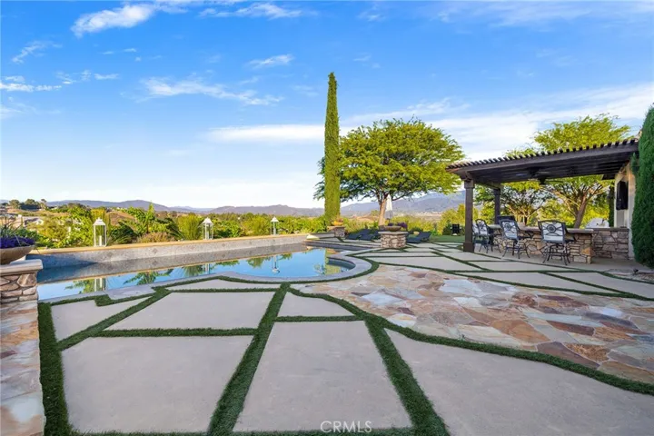 Elegant custom hardscapes accent the yard