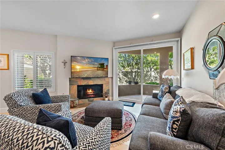 This open and airy living room seamlessly flows into the backyard, creating the perfect indoor-outdoor living experience.