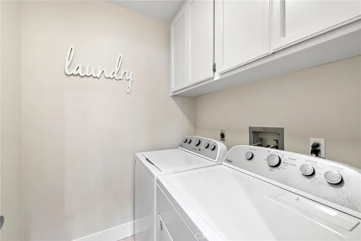 The home features a private laundry room with washer and dryer already in place.