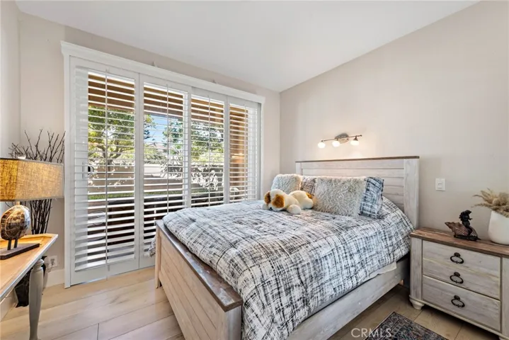 The secondary bedroom offers direct access to a private patio.