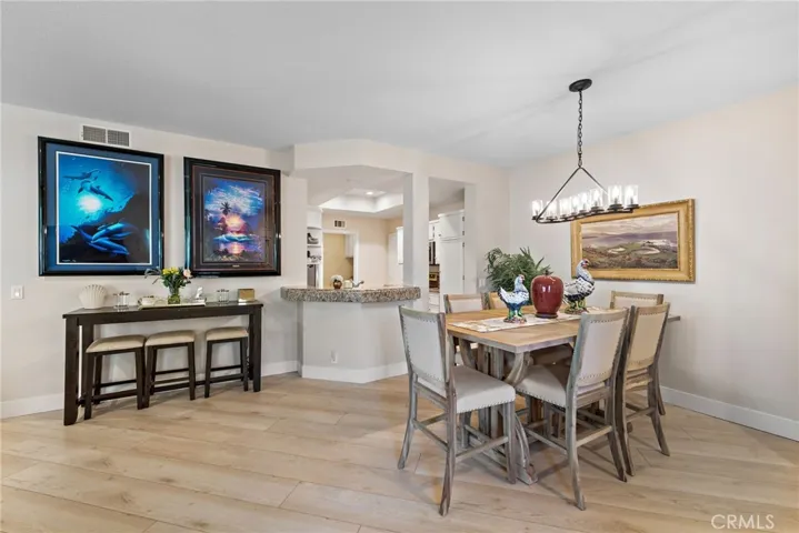 The breakfast bar opens into the kitchen, creating a perfect spot for casual dining and conversation.