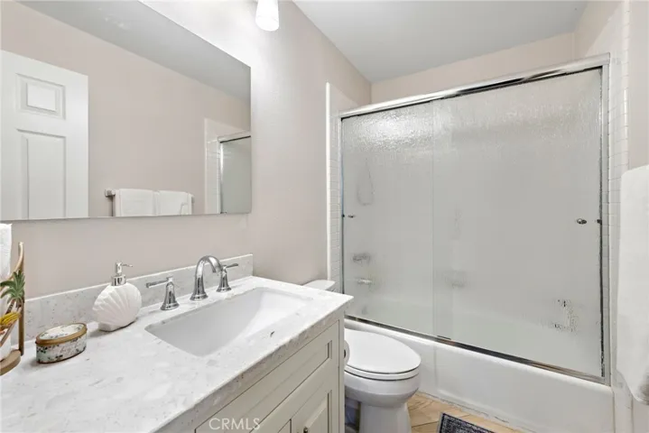 Updated guest bathroom featuring contemporary touches and a functional layout.
