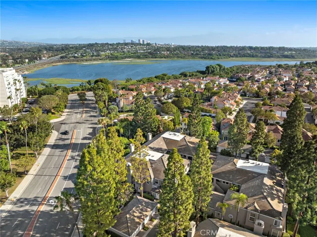 From above, the aerial views capture the condo’s prime position overlooking the Back Bay, just minutes from Fashion Island, top schools, and Newport’s scenic coastal lifestyle.

