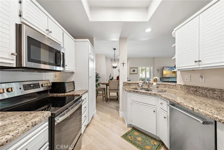 The kitchen offers a simple, efficient design with plenty of potential to personalize.