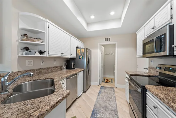The kitchen comes ready with all essential appliances included.