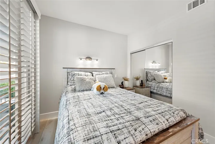 Sun-filled secondary bedroom with an open, cheerful ambiance.