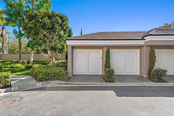 The detached garage features a clean, versatile interior—perfect for parking, storage, or a potential workshop.