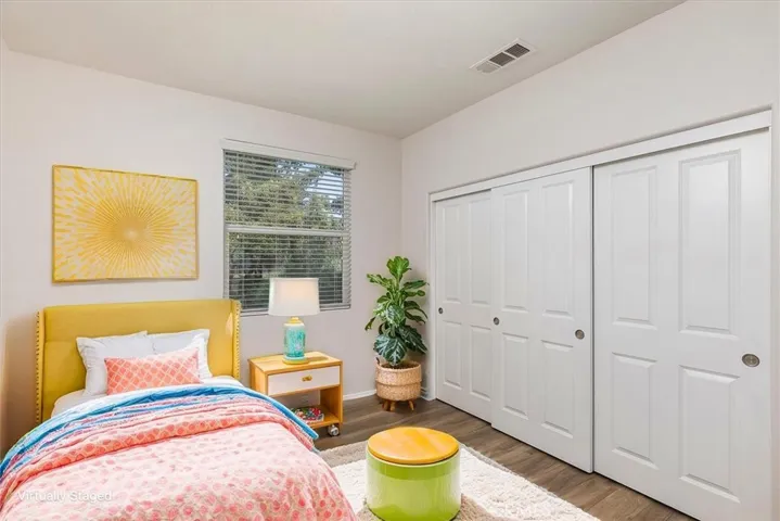 Secondary bedroom.  Image has been virtually enhanced.