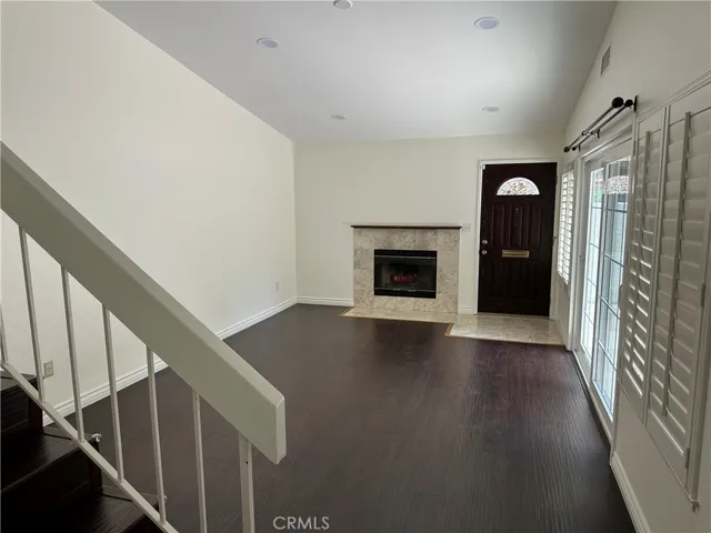 LR with fireplace and high ceilings