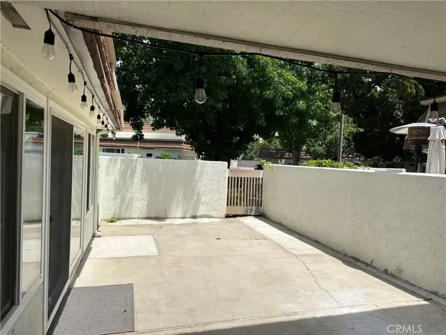 Large patio for outdoor dining and potted gardening
