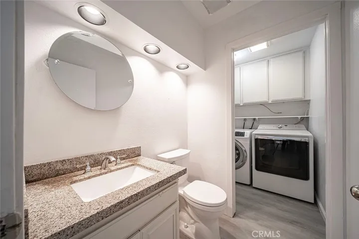 Half bathroom with laundry room attached