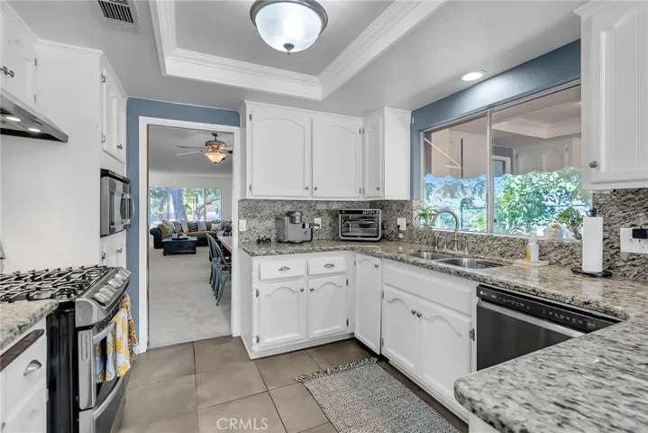 Kitchen with updated countertops and stainless-steel appliances