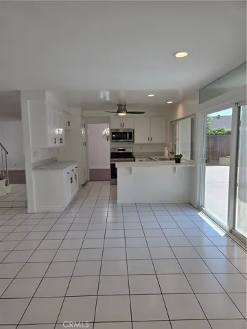 View from spacious family room to the kitchen