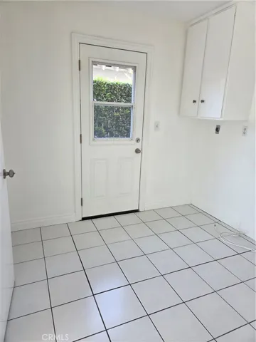 Office room adjacent to family room and leads into the two car garage