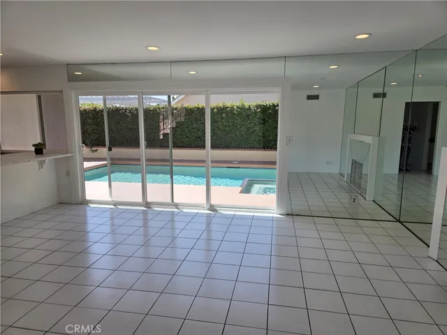 Family room with view to the backyard sparkling pool and spa