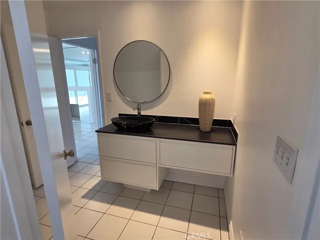 Half bath in lower level with new stylish sink vanity