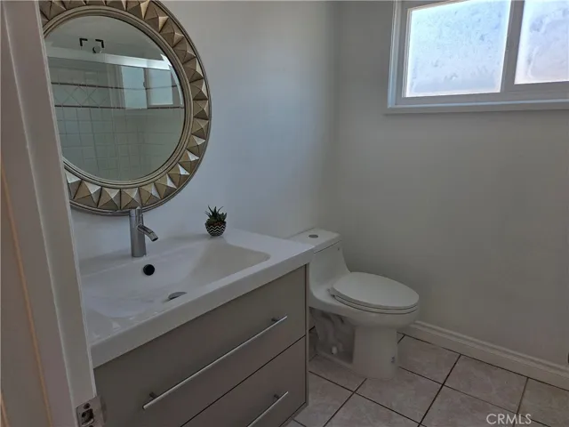 Guest bath on second level features new sink vanity