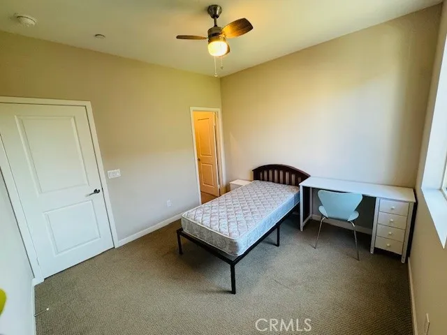 Bedroom with walk-in closet