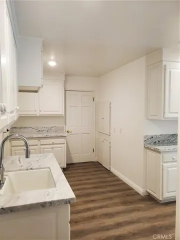 Laundry Room with Side by side washer/ dryer hookups, Utility sink and linen closets.