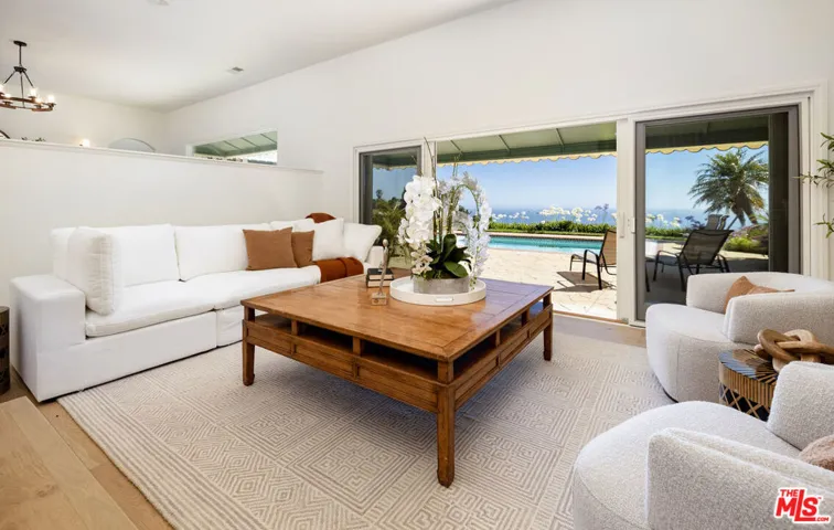 Living room opens to pool terr