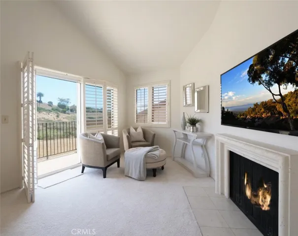 Sitting Area & Fireplace in Primary Bedroom