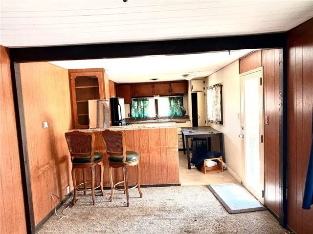 Bar area facing/  Back house kitchen