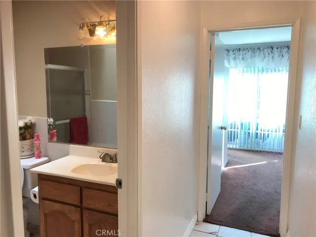 Hallway and entry to main bathroom and primary bedroom