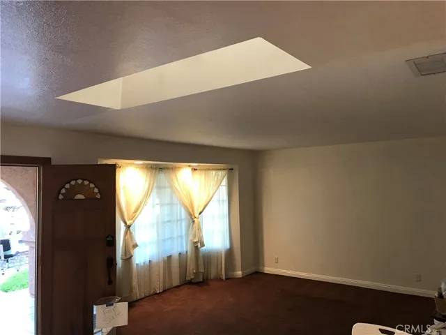 Front formal living room with updated bay windows
