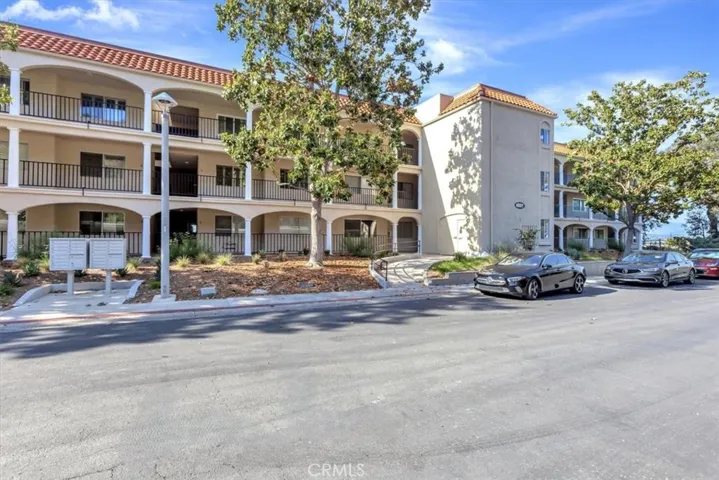 Exterior of the 4001 Building - ramp is the entry, elevator is in the 3-story stucco tower