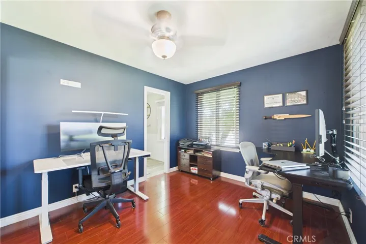 Primary bedroom currently used as dual office