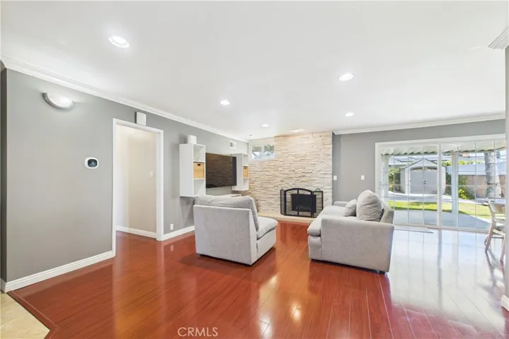 Living room w stone fireplace and slider to outside