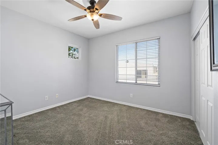 Secondary bedrooms are freshly updated with new carpet, baseboards, paint, and ceiling fans.