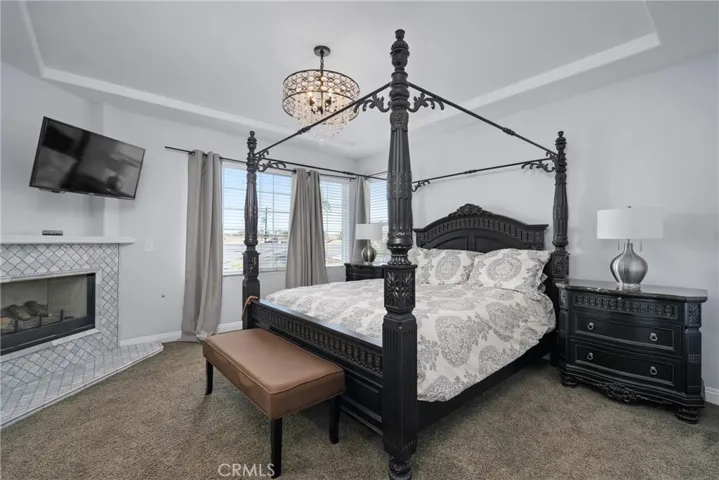 Cozy up next to the custom marble fireplace and bask in the glow of the designer chandelier.