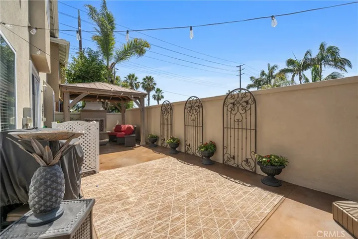 Enjoy the ocean breeze and warm Huntington Beach sun in this inviting outdoor space.