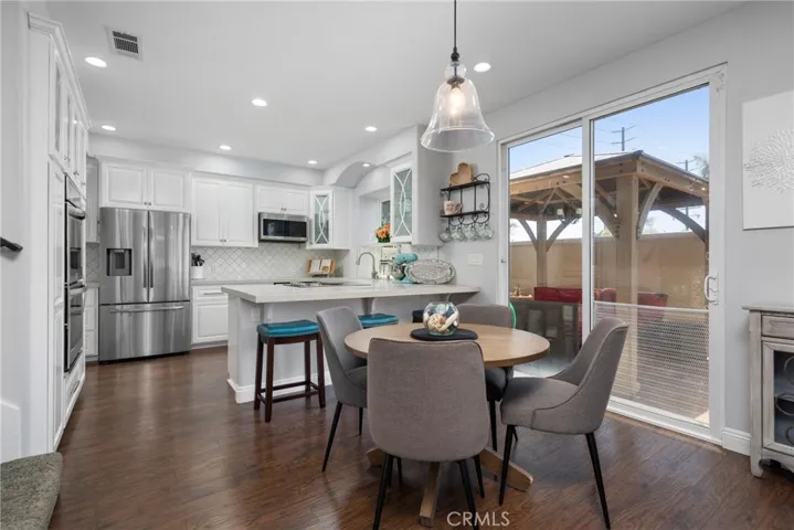 The dining area blends effortlessly into the kitchen and family room, making it the heart of the home.