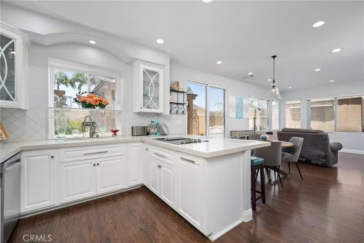A large peninsula with bar seating is perfect for casual dining, morning coffee, or entertaining guests.