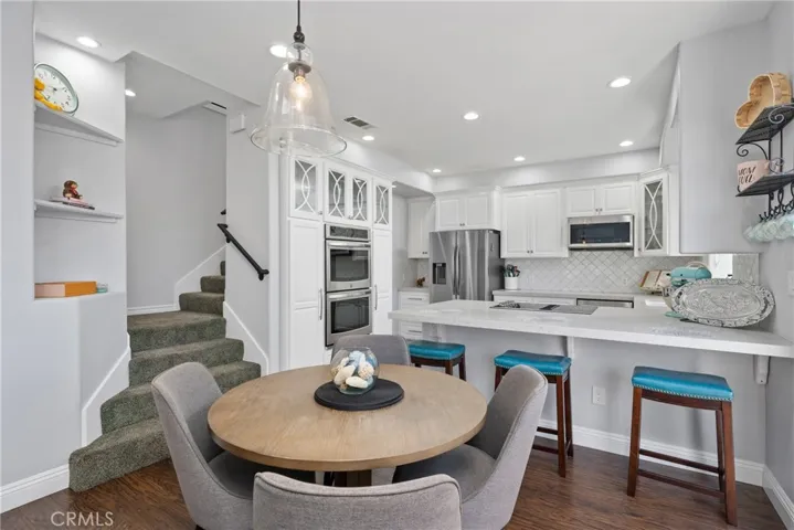 A spacious dining nook is perfectly positioned for formal dinners or casual weeknight meals.
