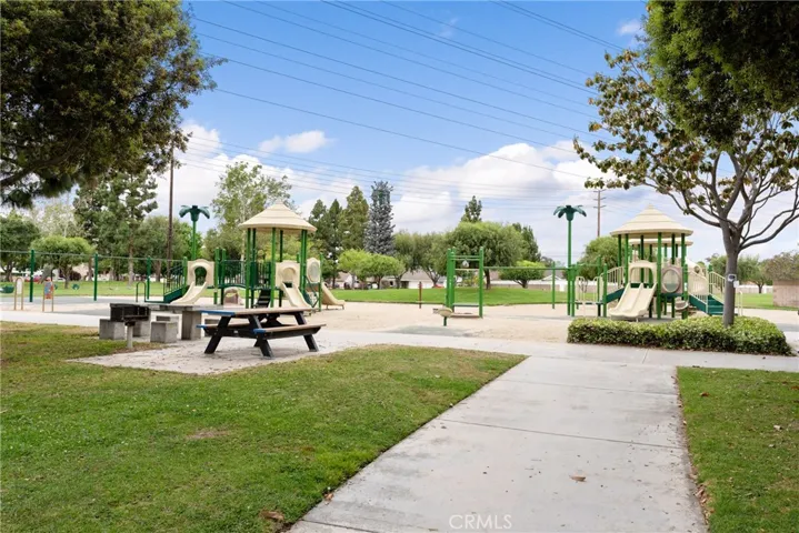 Enjoy your friendly neighborhood park with playground and picnic tables!