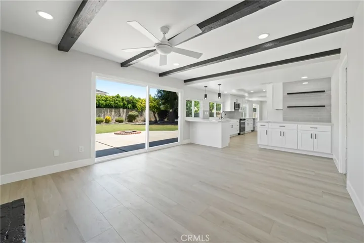 Located just off the kitchen, the living room provides the perfect space for gathering.