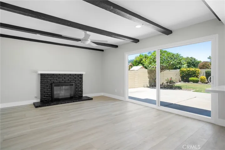 Nicely sized living room with a cozy fireplace and sliding doors to the backyard!
