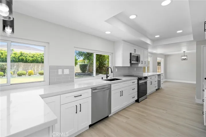 Enjoy prepping meals in this bright, welcoming kitchen that opens to the living room.