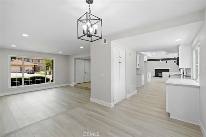The dining area flows seamlessly between the kitchen and living spaces for easy hosting.
