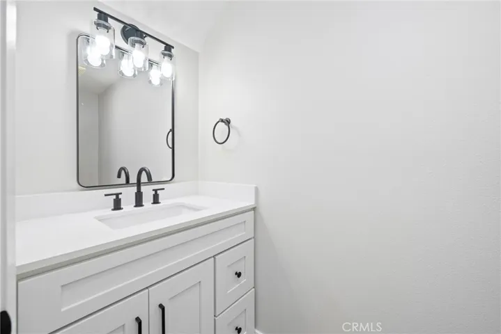 Convenient downstairs half bath, nicely updated with modern fixtures.