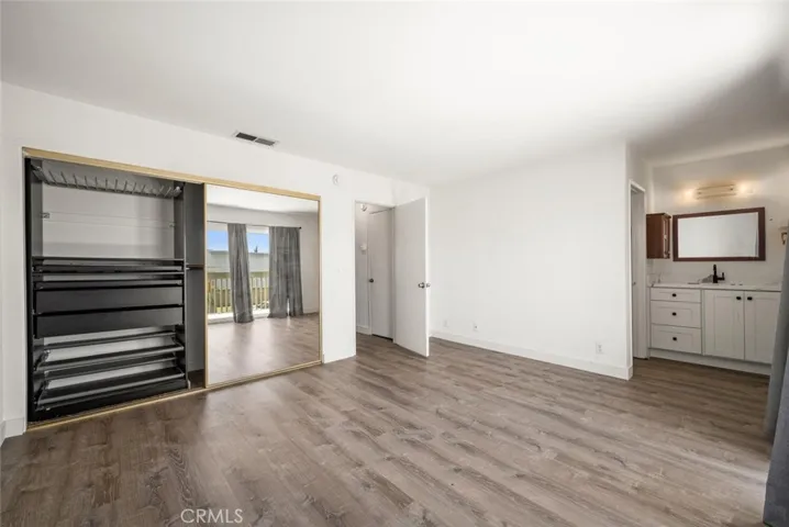 Master bedroom, with closet organizer.