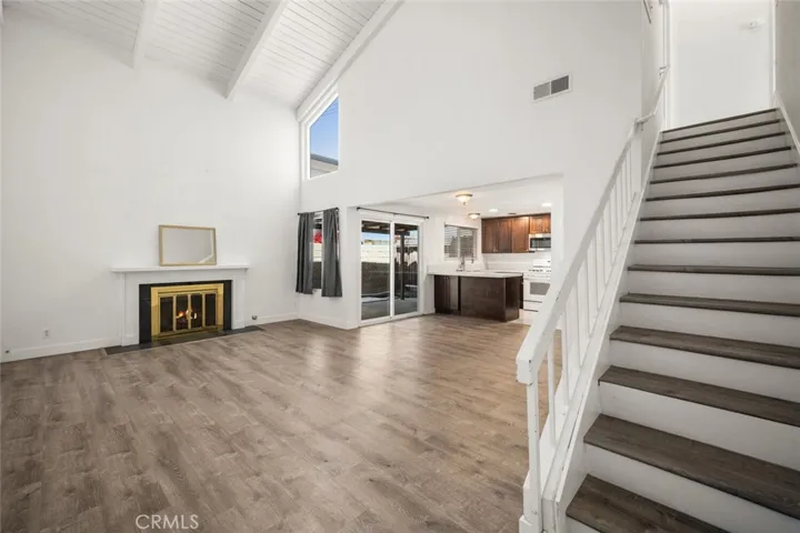 Living room with stairs to bedrooms.