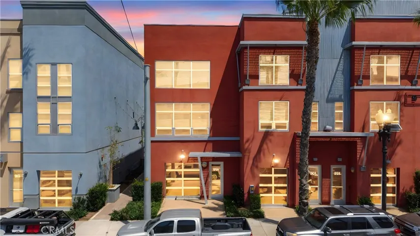 End unit with extra large windows, a private overhang at the front door, and extra windows on the side as well because its an end uni.