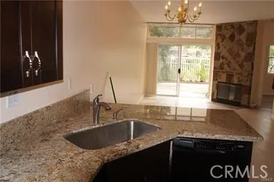 Kitchen Open to Living Room with Fireplace