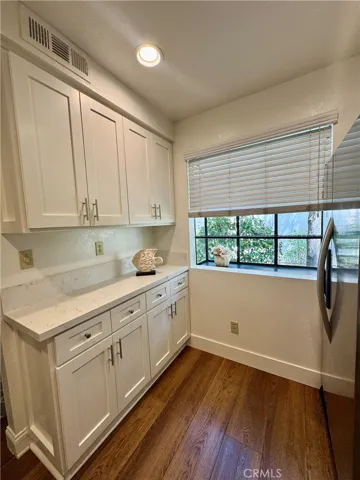 View from the sink area in the kitchen looking out toward the front window