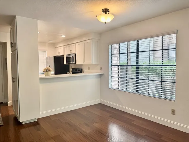 Looking toward dining room and kitchen from the living room
